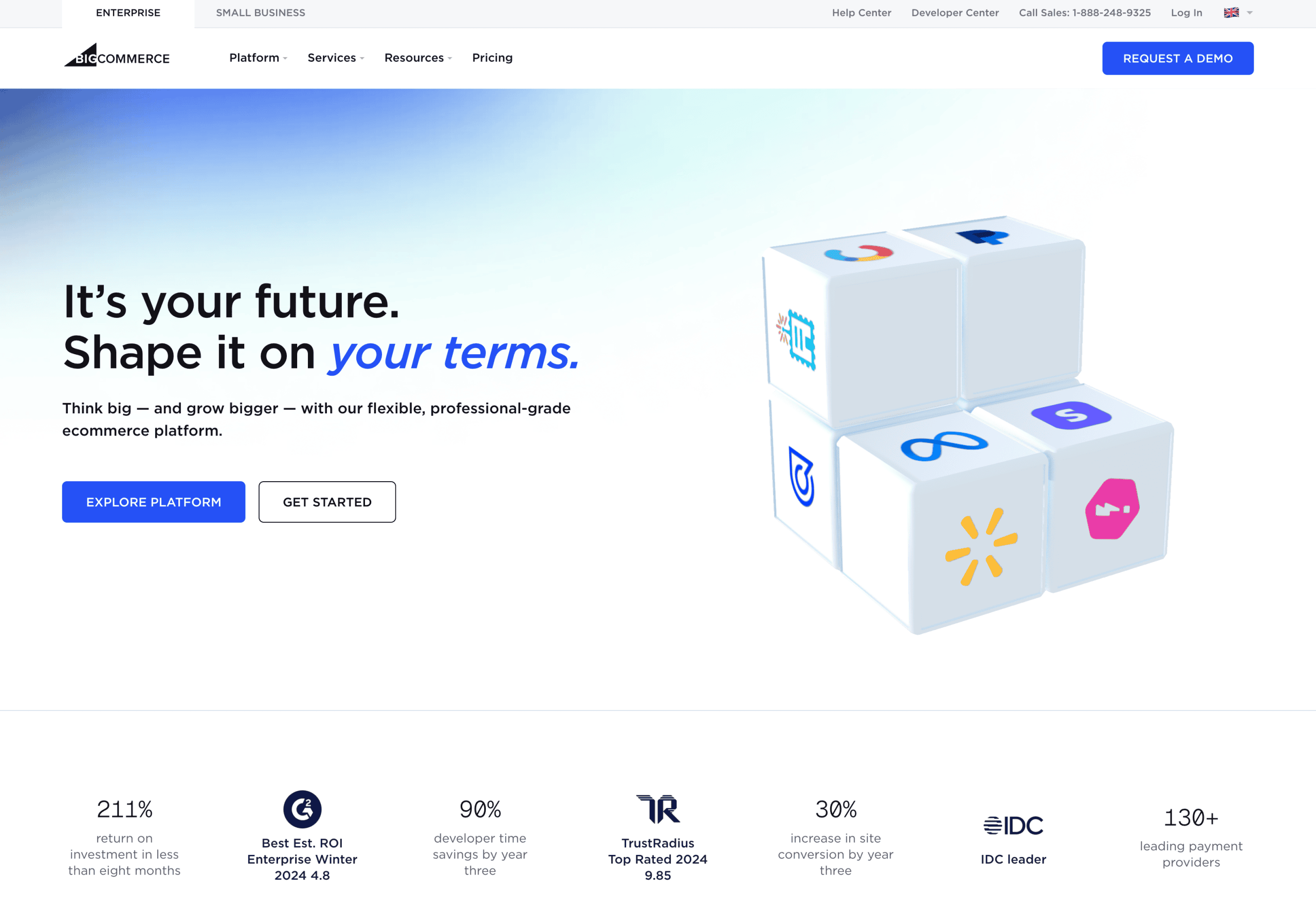 A website homepage for an ecommerce platform features a 3D cube graphic with icons and text promoting flexible, professional-grade services and clear calls to action to explore the platform or get started.