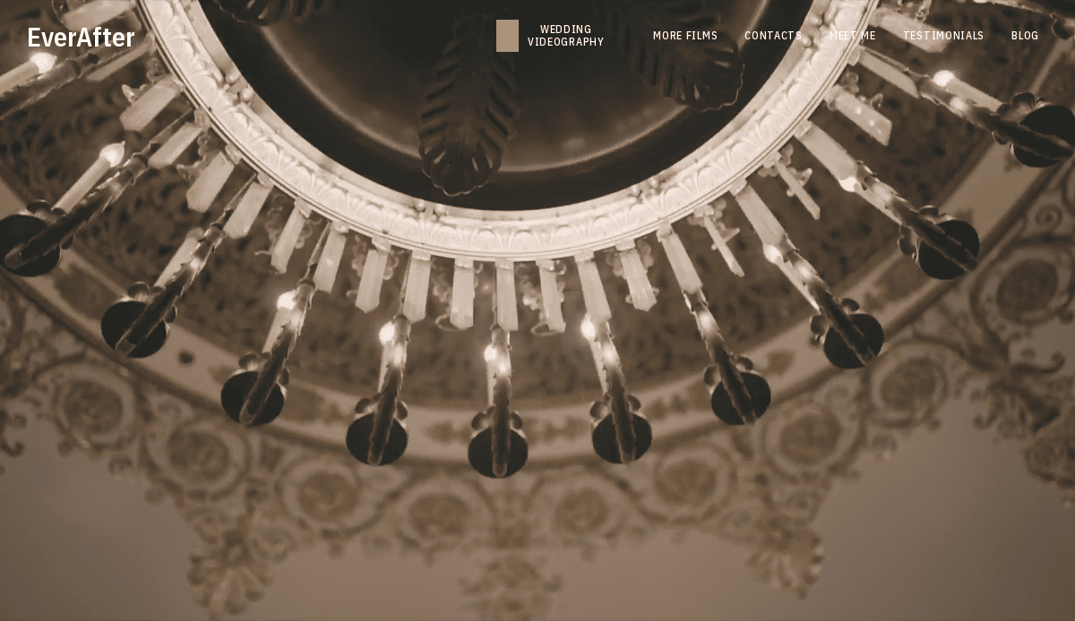 Close-up view of an ornate chandelier with lit bulbs, photographed from below, showing intricate golden details on the ceiling. The EverAfter wedding website navigation bar is visible at the top.