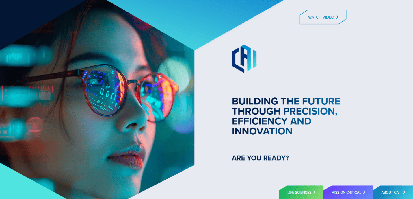 A woman with glasses reflects colorful digital data screens; text beside her reads, “Building the future through precision, efficiency and innovation. Are you ready?”—showcasing cutting-edge manufacturing website design with navigation for video, life sciences, mission, and about us.