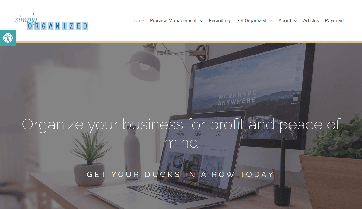 A workspace with a laptop, monitor, lamp, and plant on a desk. The screen displays WORKHARD ANYWHERE. Text overlay reads: Keep it running smoothly—organize your business for profit and peace of mind. Get your ducks in a row today.