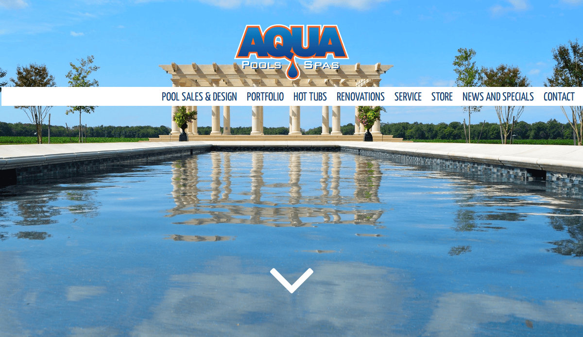A clear blue swimming pool with stone columns and trees in the background, under a bright sky, showcases Aqua Pools & Spas’ branding—perfect inspiration for a stunning pool service website design.
