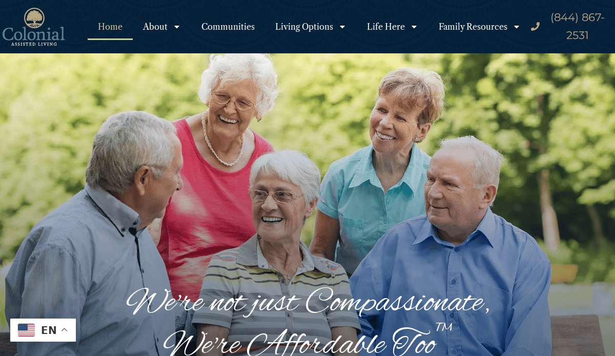 Five smiling elderly people, three women and two men, gather outdoors in lively conversation. The image appears on a senior living website for Colonial Assisted Living, with clear navigation and contact details at the top.