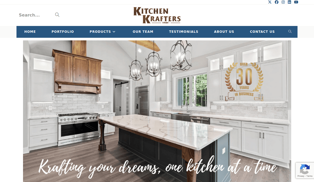 A modern kitchen with white cabinets, a large marble island, stainless steel appliances, and wooden accents. Text reads: Krafting your dreams, one kitchen at a time—experts in Kitchen Remodeling with over 30 years in business.