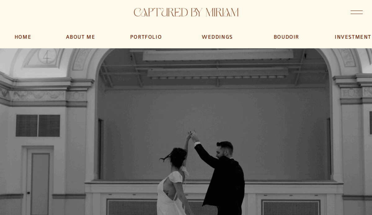 A couple dances in a large, elegant room with high ceilings, viewed from behind. The website header reads Captured by Miriam with navigation links—perfect inspiration for wedding website designers seeking timeless romance.