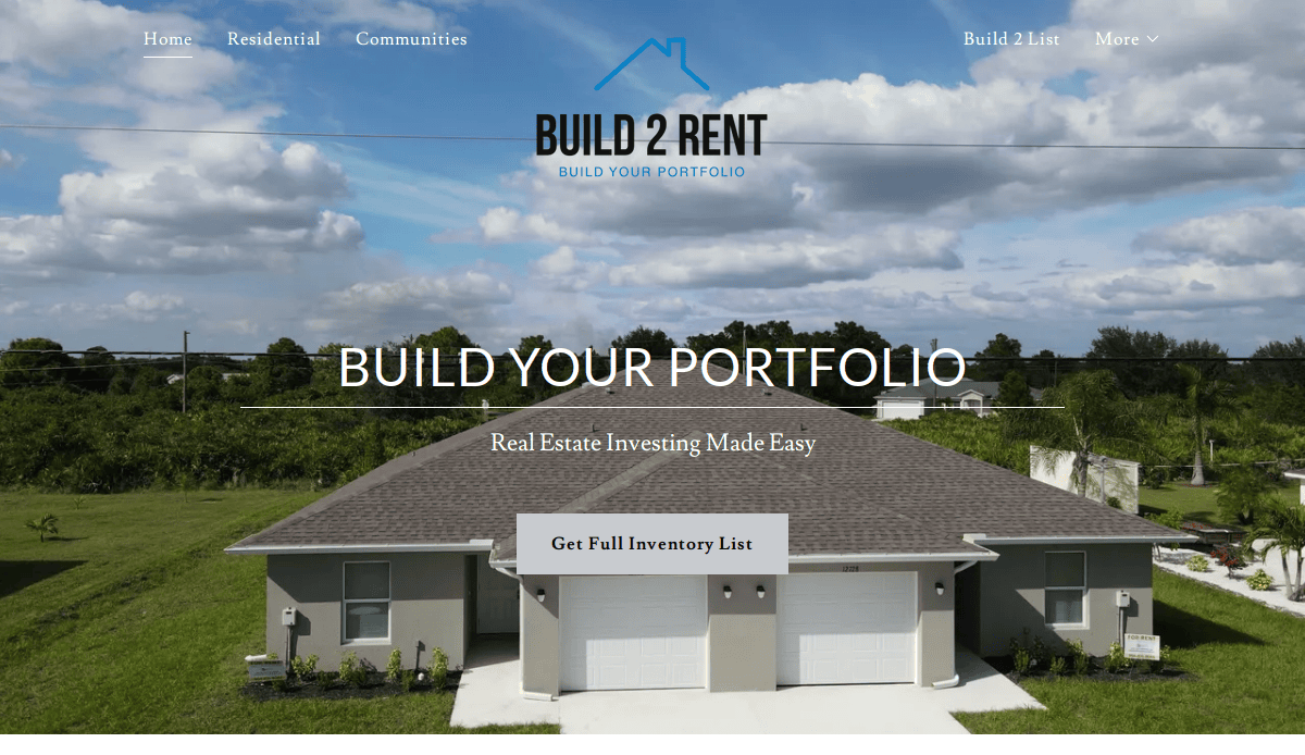 A modern duplex house with garages sits in front of green trees and bushes under a blue sky with clouds. The property management website header reads Build 2 Rent: Build Your Portfolio with real estate investing options.