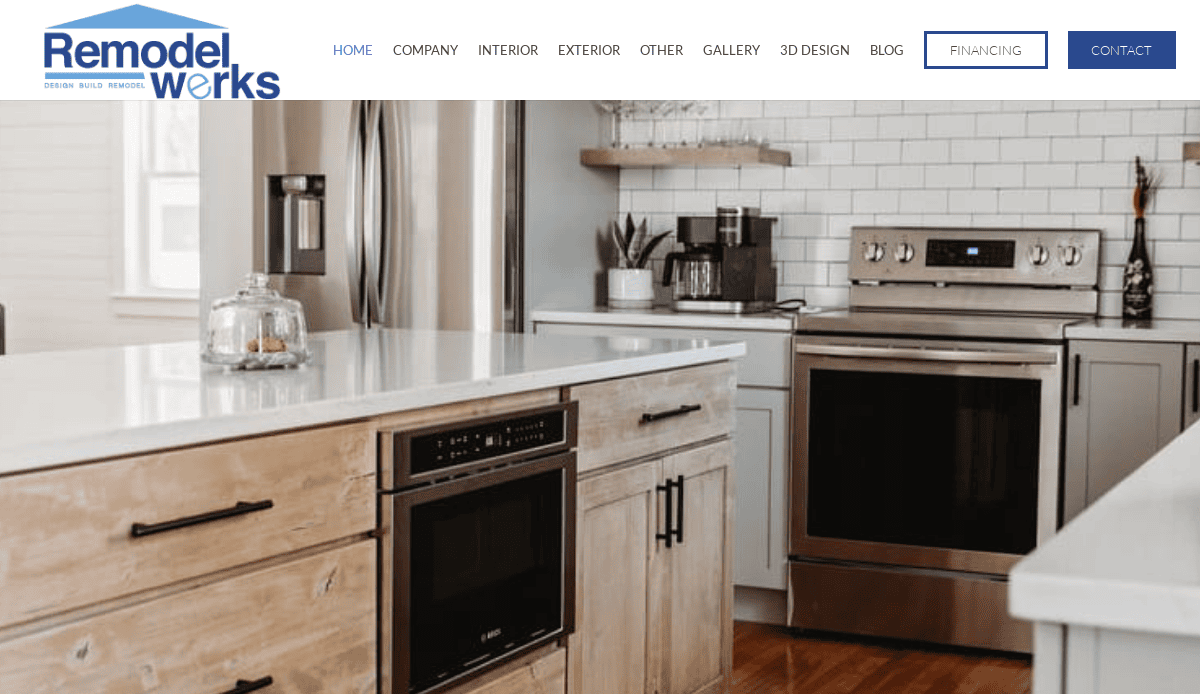 Modern kitchen remodeling features stainless steel appliances, a white subway tile backsplash, wooden cabinets, built-in microwave, and a large white island countertop. The bright space is filled with natural light.