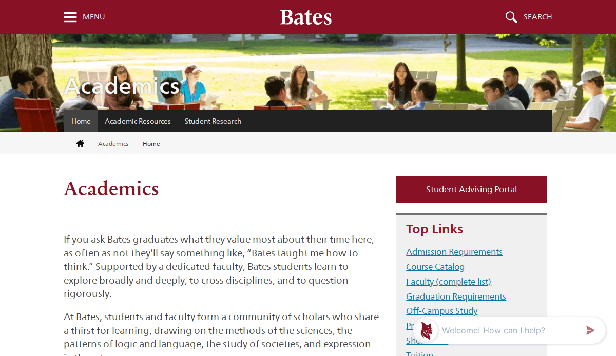 A group of students and a professor sit around a table outdoors on campus. The Bates College Education Website Design features an Academics headline, navigation links, and top links on the right for a user-focused site experience.
