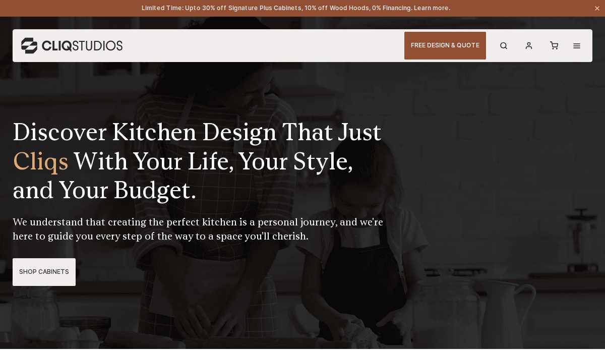 A website homepage shows a mother and child preparing food in a kitchen. Text reads, Discover Kitchen Design That Just Cliqs With Your Life, Your Style, and Your Budget. Explore our kitchen portfolio and find inspiration with headline banners featuring special offers.