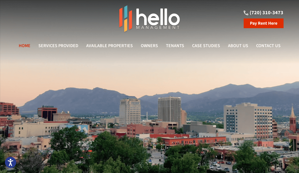A city skyline with buildings and mountains in the background, featuring the Hello Management logo and website navigation menu across the top. Showcasing modern Property Management Website Design, a Pay Rent Here button and contact phone number are visible on the right.