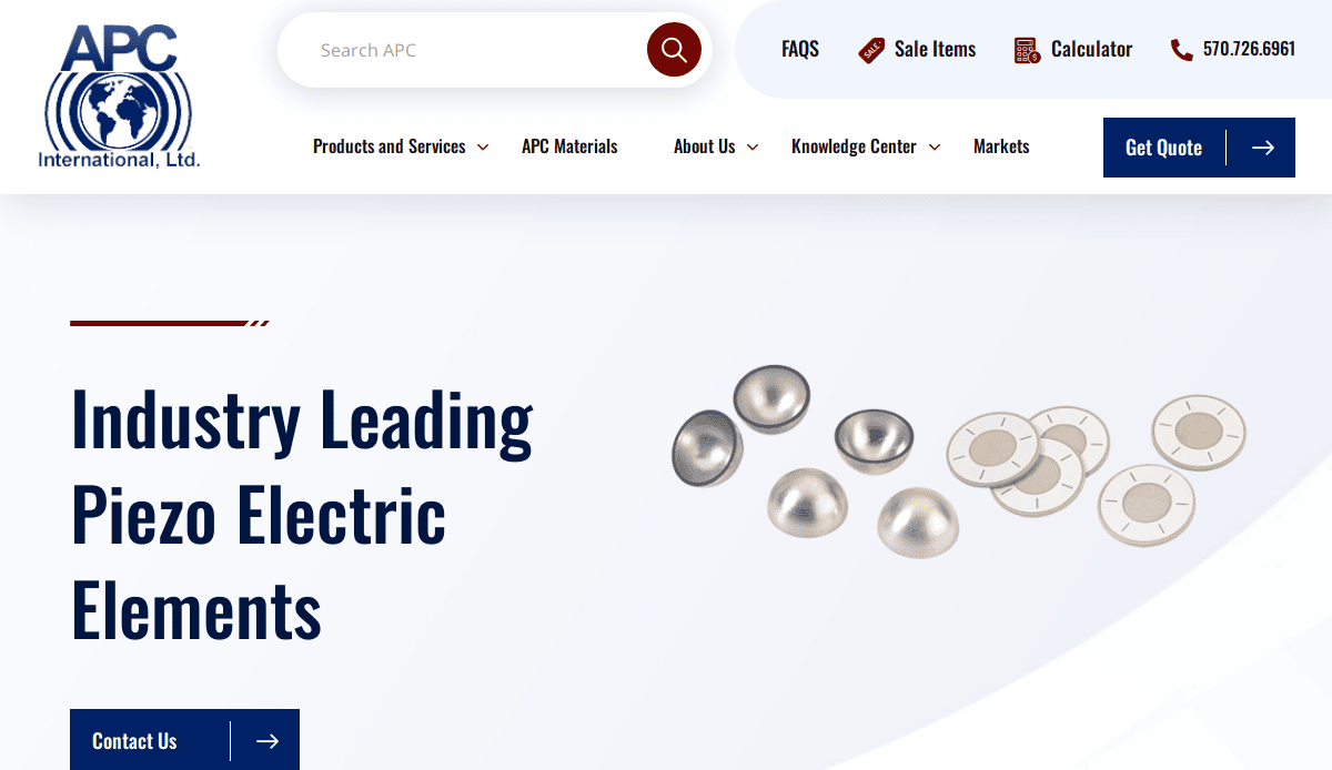 Screenshot of the APC International manufacturing website homepage with a blue and white theme, featuring the headline Industry Leading Piezo Electric Elements and images of round metallic and ceramic piezoelectric components.