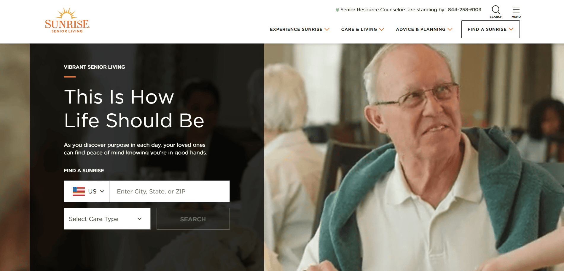 An elderly man wearing glasses and a light shirt smiles while sitting at a table, a hand on his shoulder. The Senior Living Website Design features a search bar for locations and care types, helping you find the best options for loved ones.