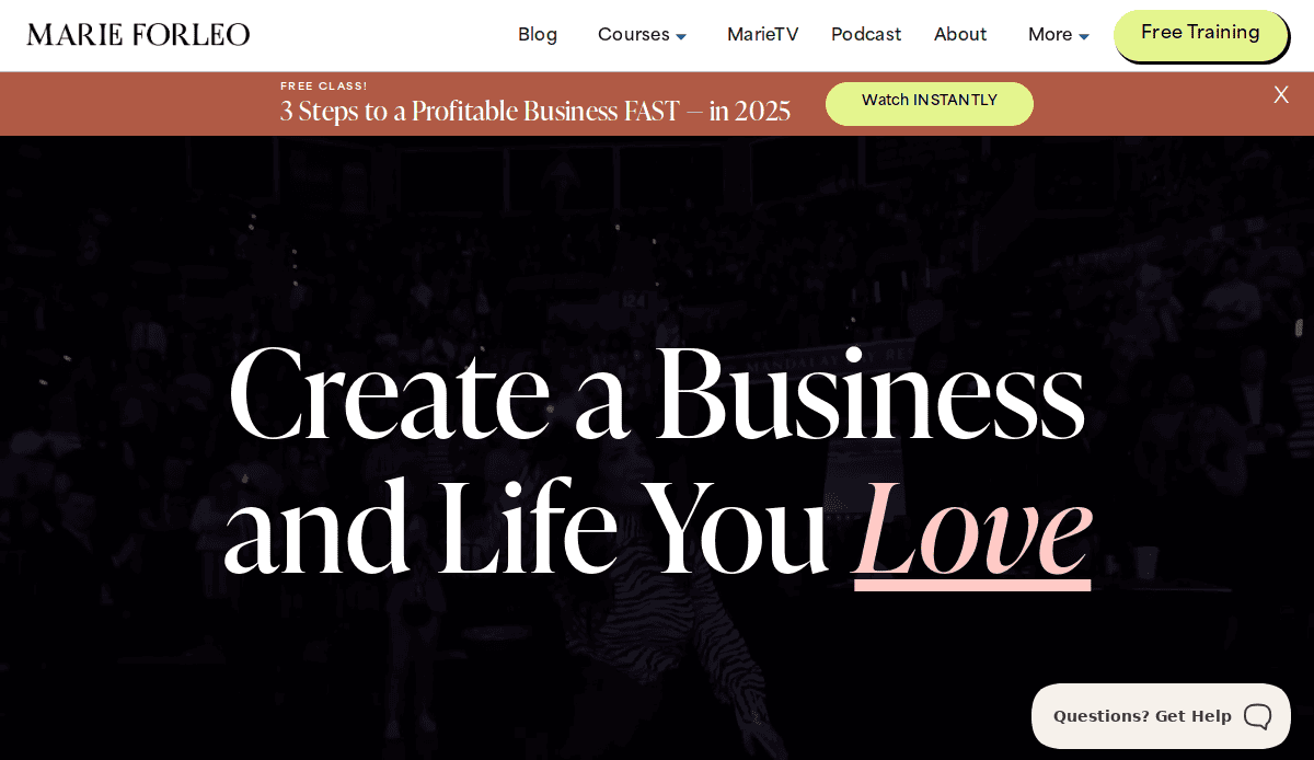 Website homepage for Marie Forleo’s life coach website featuring a header, navigation menu, call-to-action for free training, and large text reading Create a Business and Life You Love—perfect to fix losing clients—over a dark blurred background.