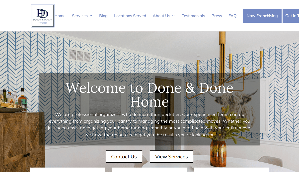 Screenshot of the Done & Done Home website homepage, showcasing expert home organizers, a blue and white patterned wall, a chandelier, and a framed cow photo. The welcoming text highlights their organizing services.
