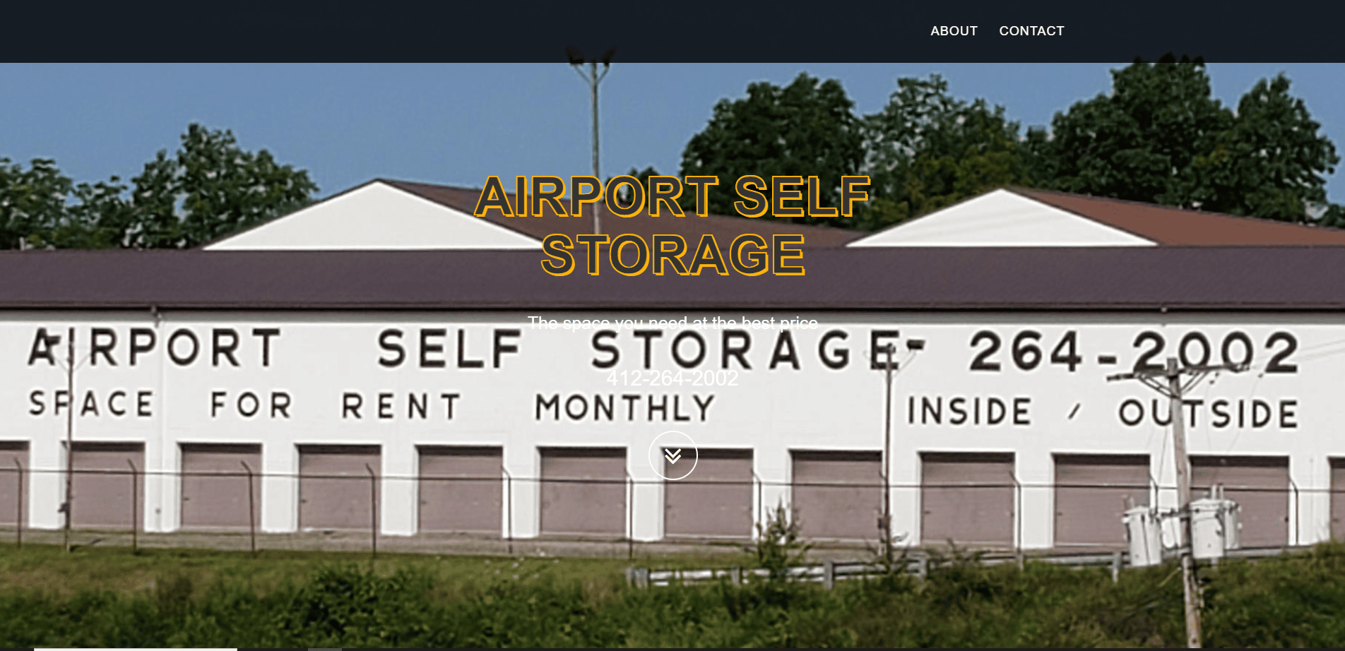 A large white building labeled Airport Self Storage with contact info and Space for rent monthly, inside/outside written on the side. Trees and sky are visible in the background.