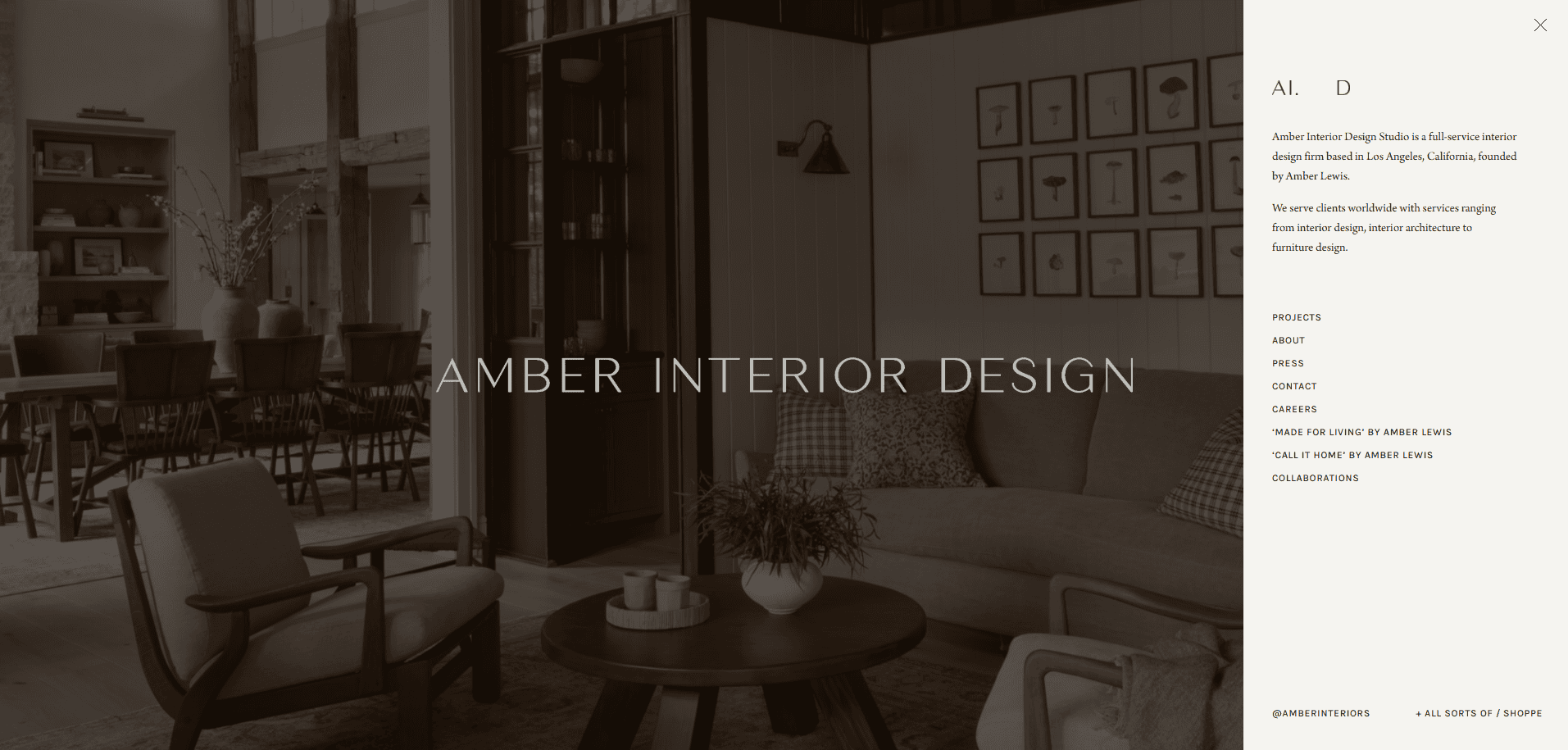 A modern living room with neutral tones, wooden beams, a round coffee table, armchairs, a gray sofa, and wall art. Text overlay reads AMBER INTERIOR DESIGN with a sidebar menu on the right.