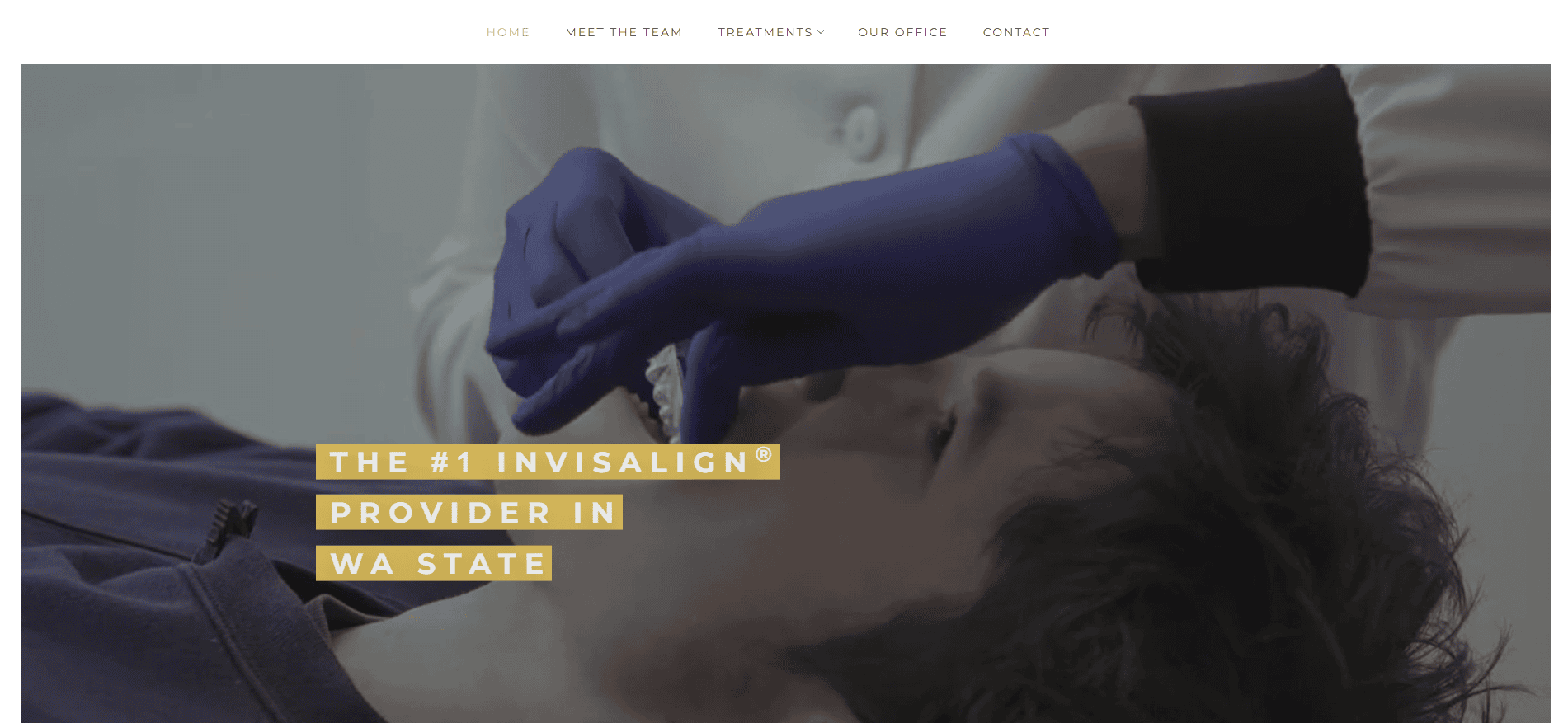 A person lying down receives a dental procedure from someone wearing purple gloves. Text on the image says, The #1 Invisalign provider in WA State. Website navigation options are visible at the top.