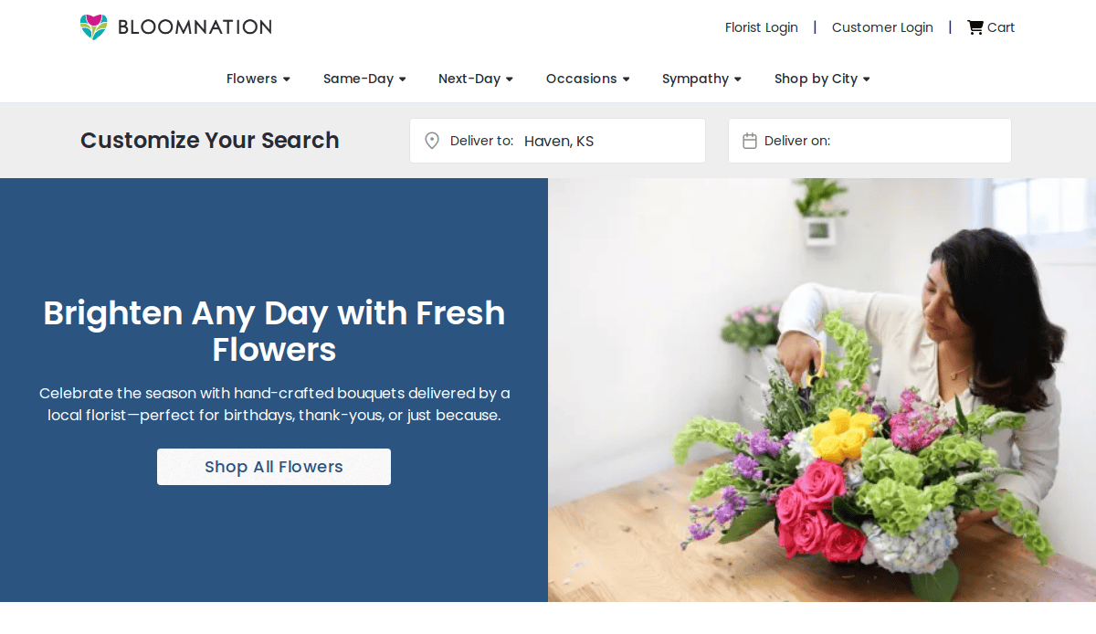 A woman arranges a colorful bouquet of flowers on a table. The website banner reads, “Brighten Any Day with Fresh Flowers,” with a button below to shop all flowers. The BloomNation logo is visible at the top.