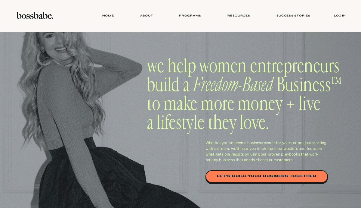 A grayscale photo of a smiling woman in a long-sleeve top and skirt sits beside bold yellow and white text promoting support for women entrepreneurs and a coral button labeled “Let’s Build Your Business Together.”.