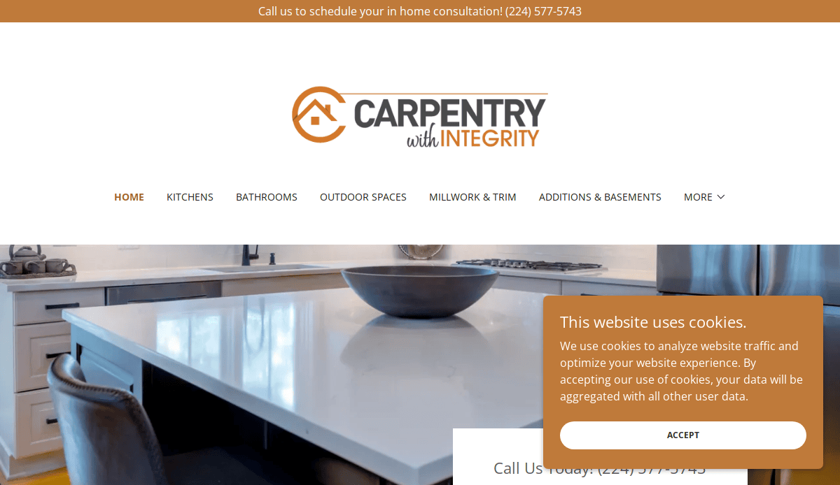 Screenshot of Carpentry with Integrity’s website homepage, showing the logo, navigation menu, a kitchen with a white island countertop, and a cookie consent popup in the lower right corner.