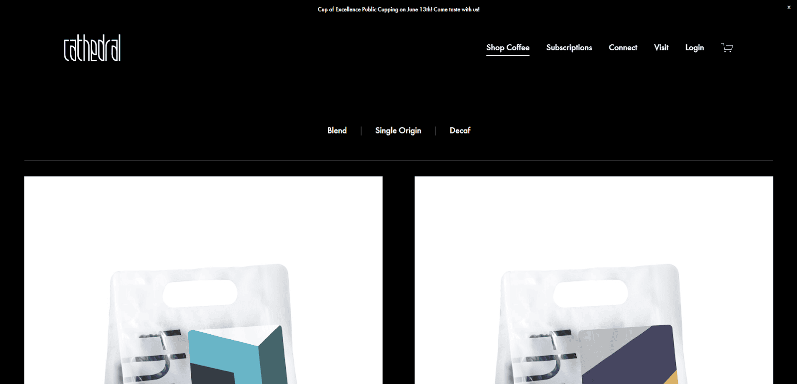 Screenshot of Cat & Cloud Coffee’s website homepage, showing a black navigation bar with options like Shop Coffee, Subscriptions, and Login, and partial images of coffee bags below.