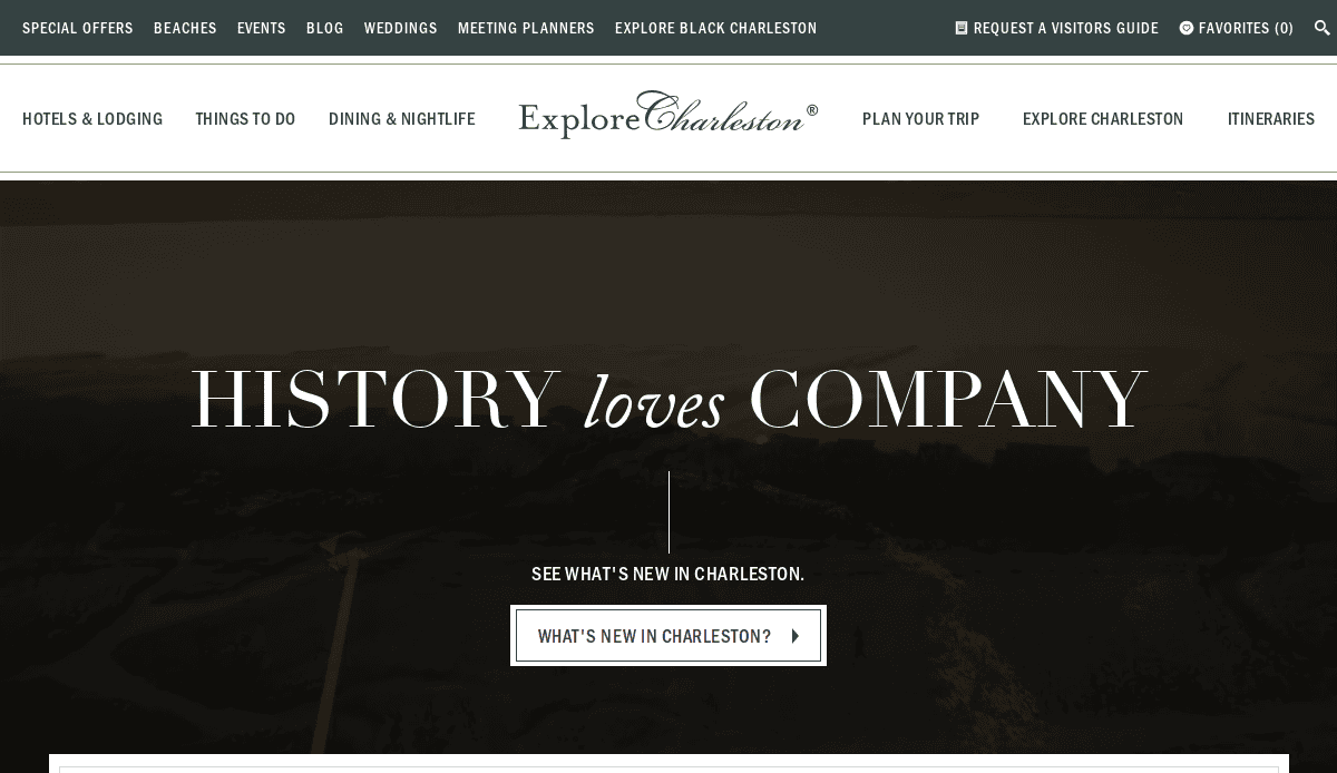 Website homepage for Explore Charleston with a navigation bar, the text HISTORY loves COMPANY in large letters, and a button labeled WHATS NEW IN CHARLESTON? inviting visitors to learn more.