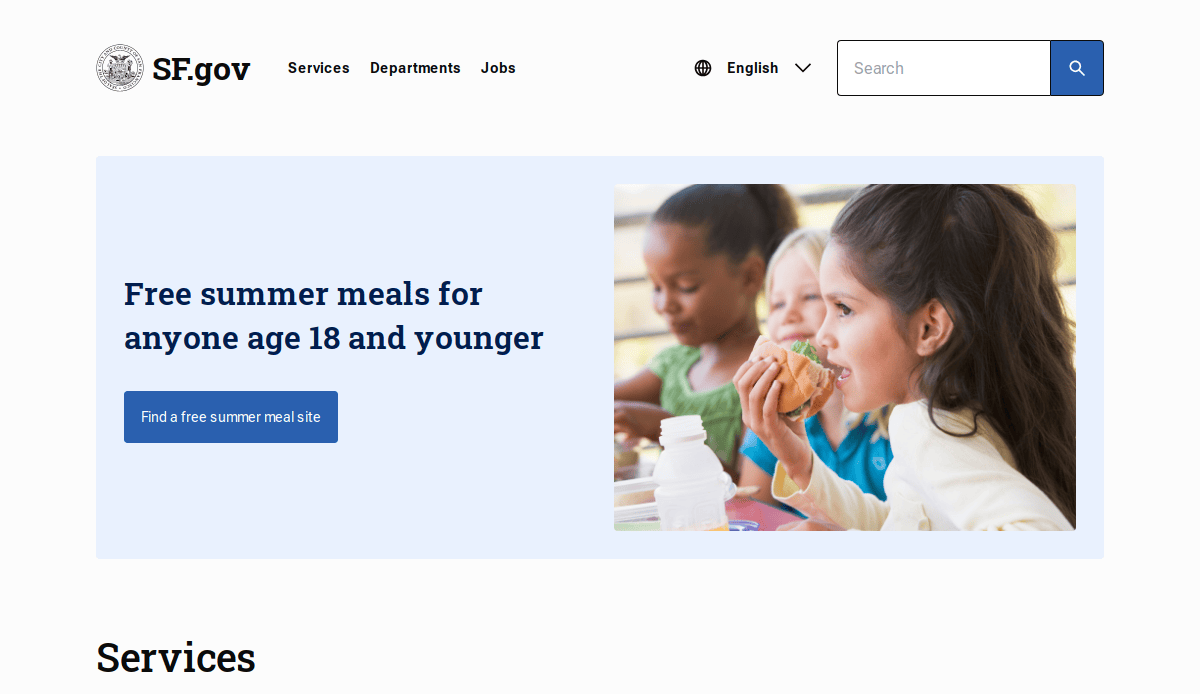 Three children sit at a table eating lunch. Next to them, a message on a blue background reads: Free summer meals for anyone age 18 and younger with a button labeled Find a free summer meal site.
