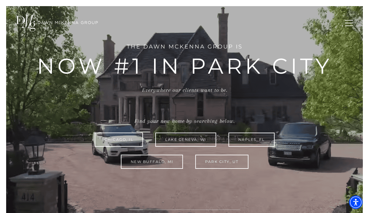A large, elegant house with a circular driveway is shown. Three luxury SUVs are parked in front. Text over the image reads, The Dawn McKenna Group is now #1 in Park City. Search location buttons are visible below.