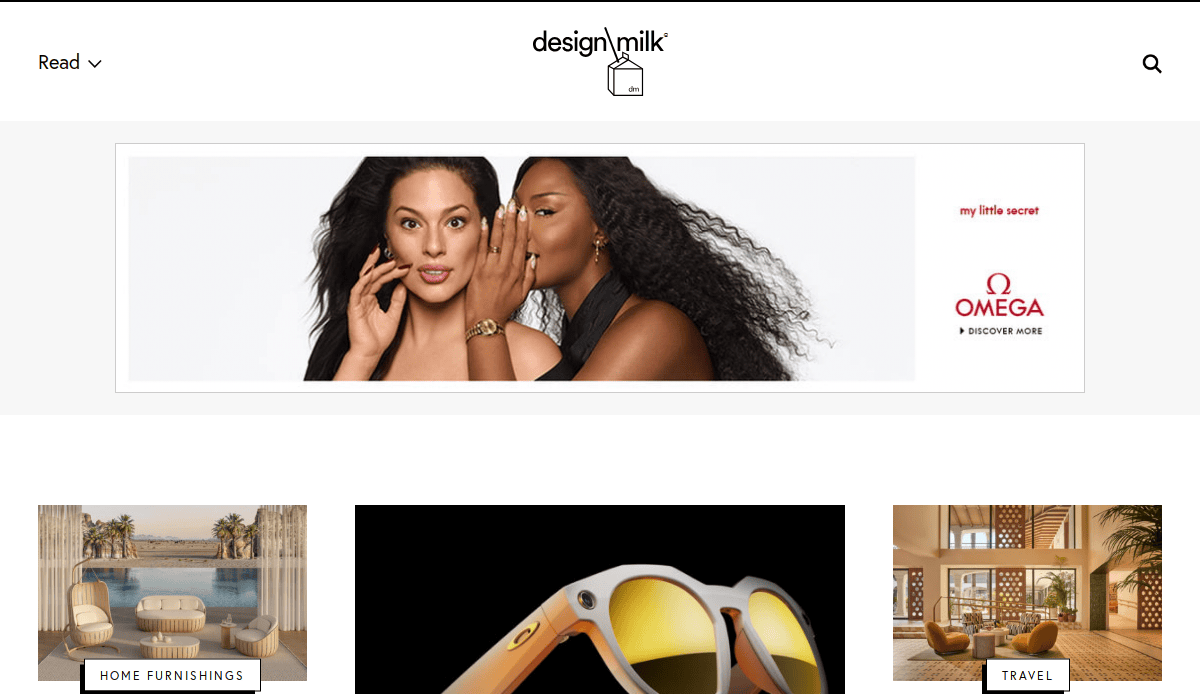 Screenshot of the Design Milk website homepage featuring a top banner ad with two women, one whispering to the other; below are categories for Home Furnishings and Travel with related images.