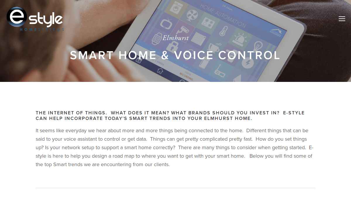 A tablet displaying a smart home control interface is held by a person. The screen shows various home automation icons. The webpage promotes E-Styles smart home and voice control solutions, explaining smart trends for Elmhurst homes.