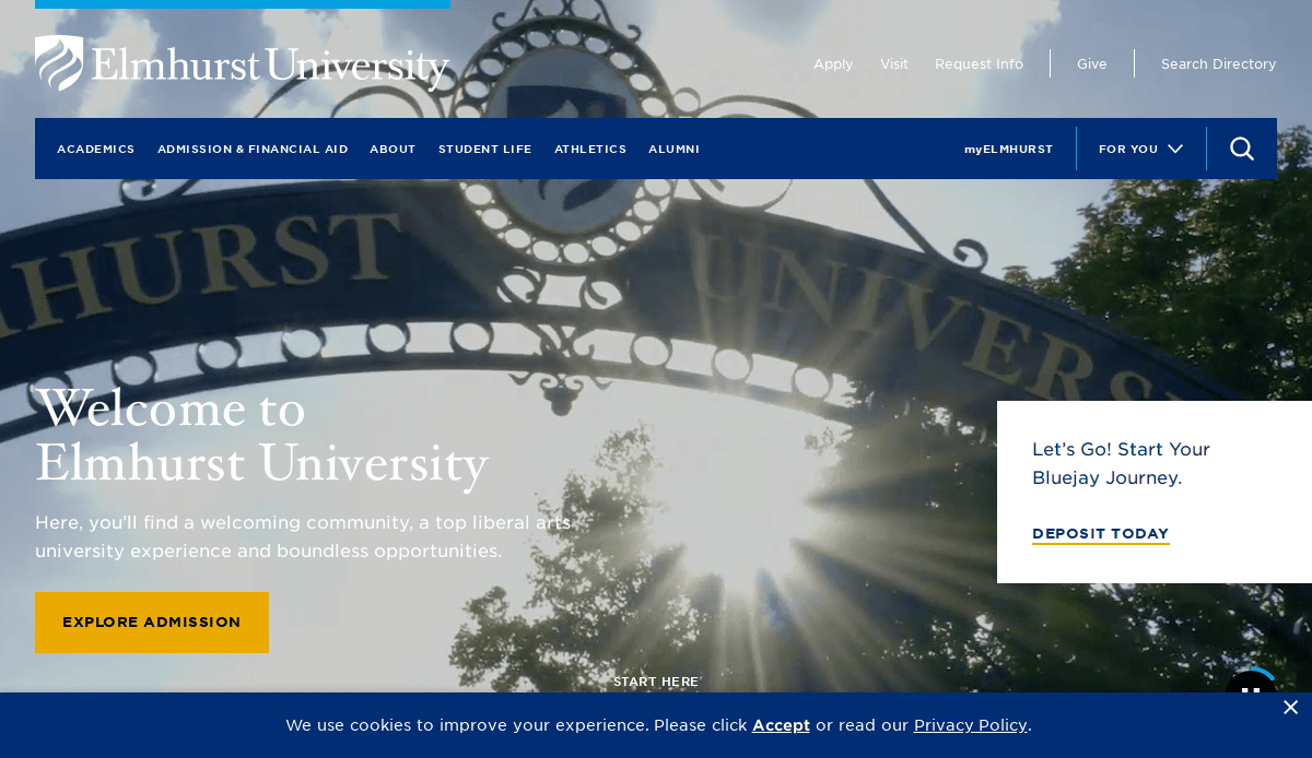 A sunlit entrance gate with Elmhurst University in decorative lettering is shown. The university logo and navigation menu appear at the top, with welcome text and admission information overlaying the image.