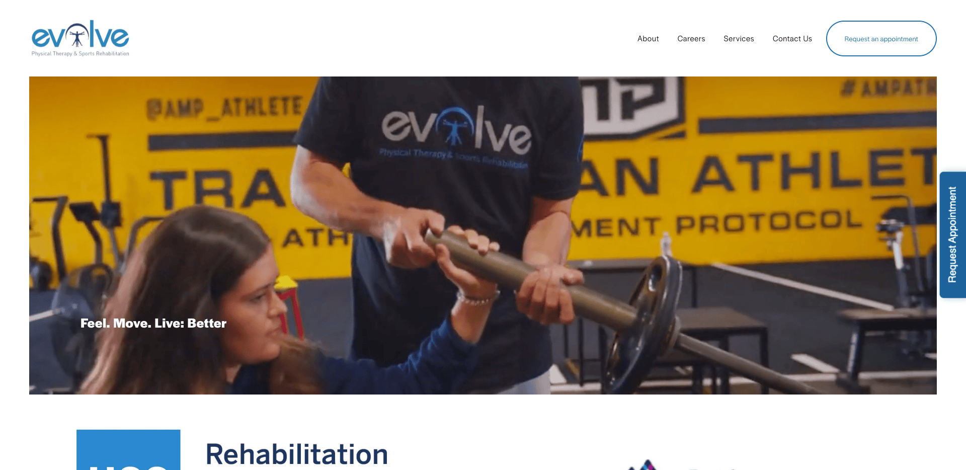 A woman receives assistance lifting a barbell from a trainer wearing an evolve shirt in a physical therapy gym with yellow walls and motivational slogans.