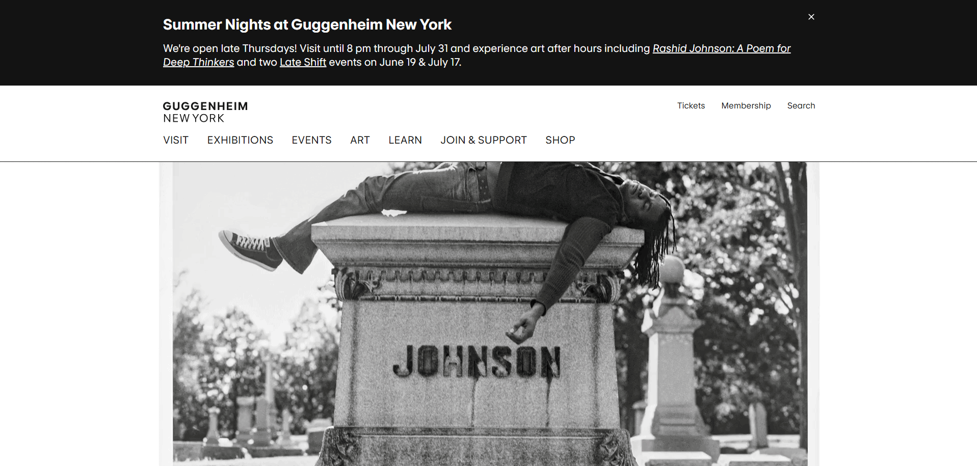 A person lies on top of a large tombstone engraved with JOHNSON in a black-and-white photo, displayed on the Guggenheim New York website under a header for Summer Nights at Guggenheim New York.