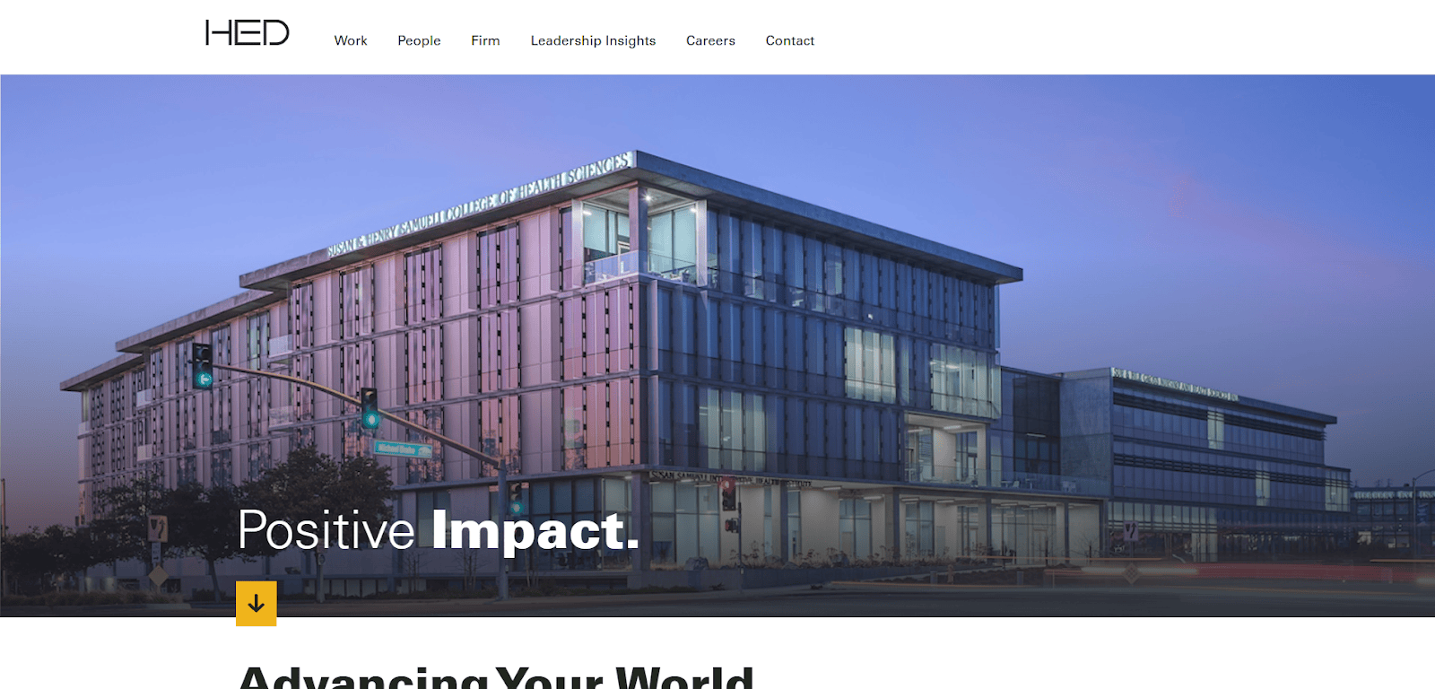 Modern glass office building at dusk with illuminated interior, traffic lights in the foreground, and Positive Impact. text overlayed. HED website navigation bar is visible at the top.