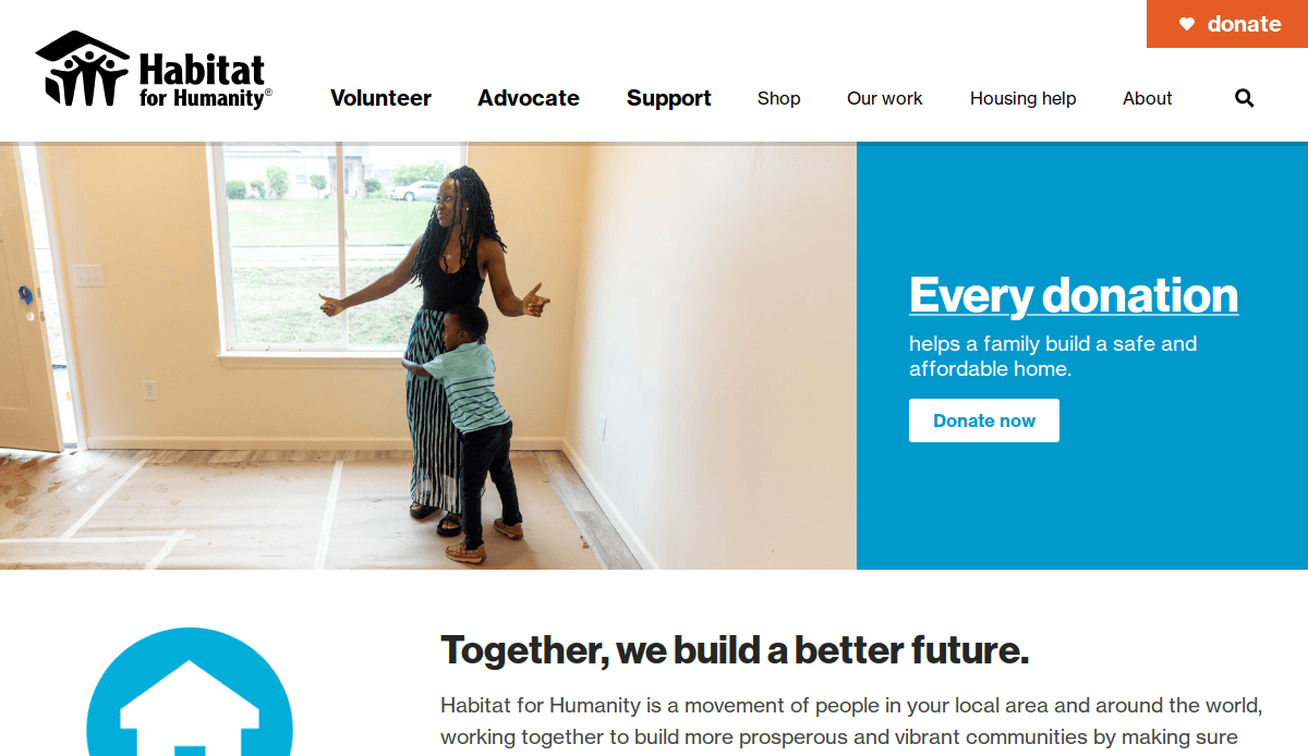 A woman hugs a child in an empty room with light walls and large windows. Habitat for Humanity logo and menu appear at the top, with a blue banner encouraging donations for safe, affordable homes.