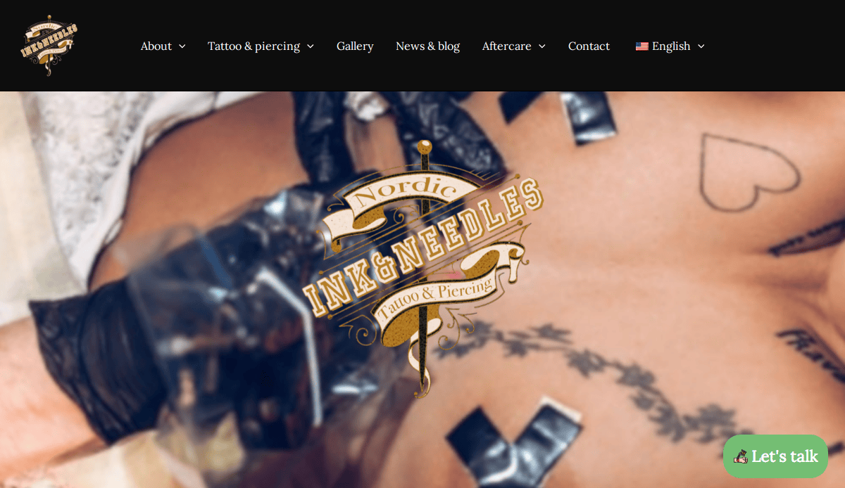 A close-up of a person’s torso being tattooed, with several tattoo designs visible and black tape covering some areas. The Nordic Ink & Needles Tattoo & Piercing logo is overlaid on the image.