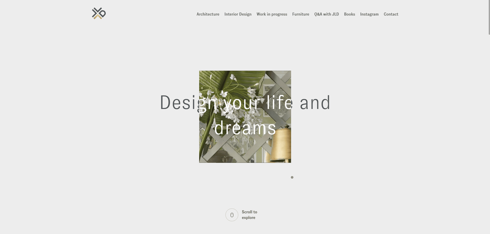 Minimalist website homepage with a central photo of green palm leaves and a gold lamp behind geometric lattice. Overlaid text reads Design your life and dreams. Navigation menu is at the top.
