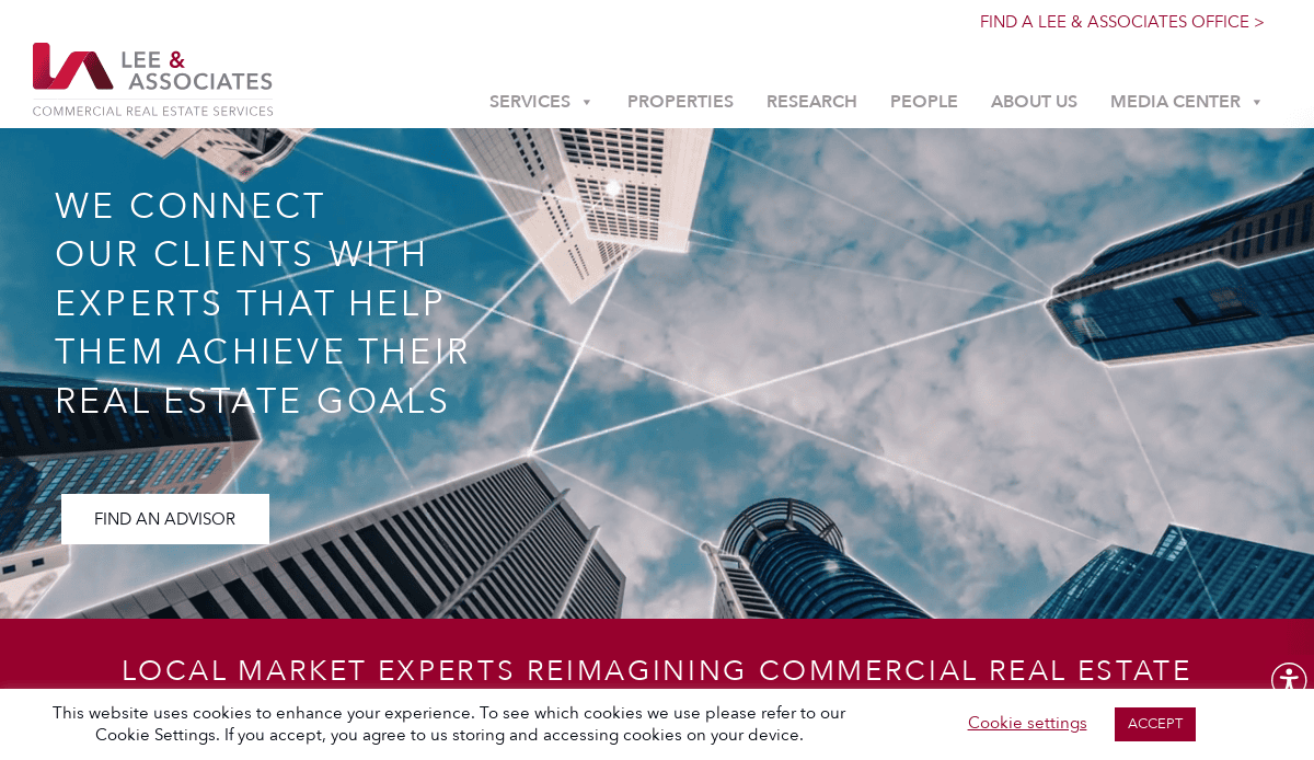 Upward view of modern skyscrapers against a blue sky, with white lines connecting buildings. Overlay text reads: “We connect our clients with experts that help them achieve their real estate goals.” Lee & Associates website interface.
