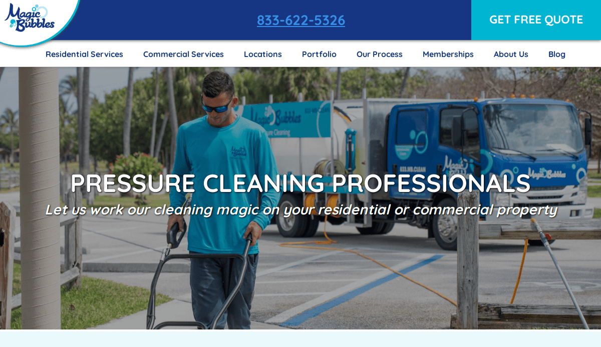 A worker uses a pressure cleaning tool on a sidewalk, with a blue Magic Bubbles truck and equipment in the background. The website header advertises pressure cleaning services for residential and commercial properties.