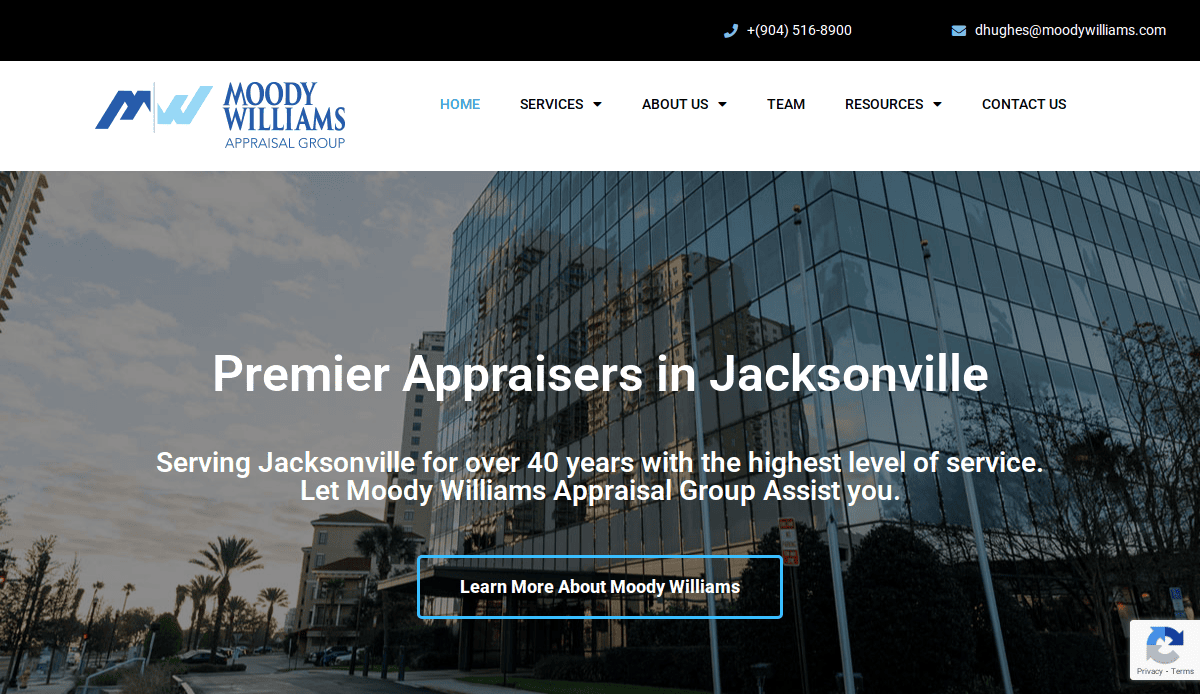 Homepage of Moody Williams Appraisal Group, featuring a modern glass office building, company logo, contact info, navigation bar, and headline stating “Premier Appraisers in Jacksonville” with a call-to-action button.