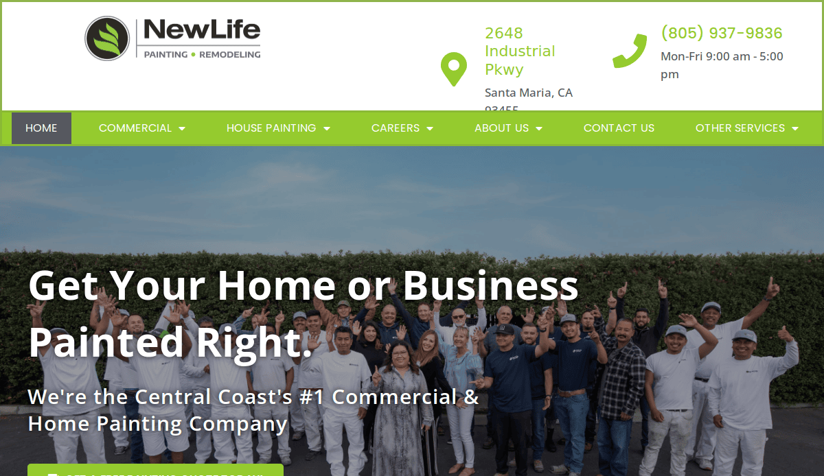 A large group of smiling people, some in white painter uniforms, pose with arms raised in front of a hedge under a banner for NewLife Painting & Remodeling, displaying contact information and navigation menu.