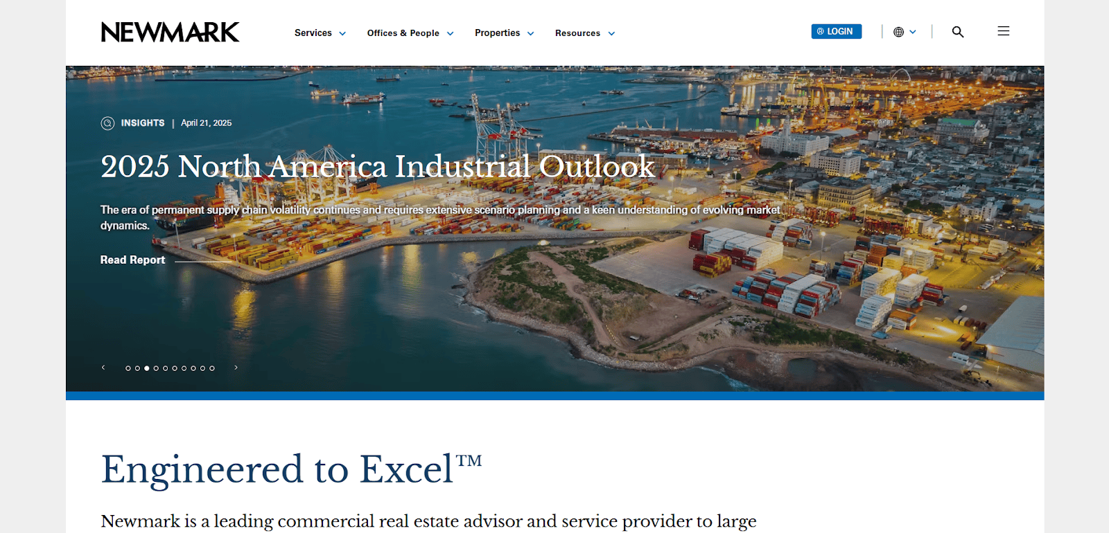 Aerial view of an industrial port at dusk with shipping containers, cranes, and city lights, featured on Newmark’s website announcing the “2025 North America Industrial Outlook” report.
