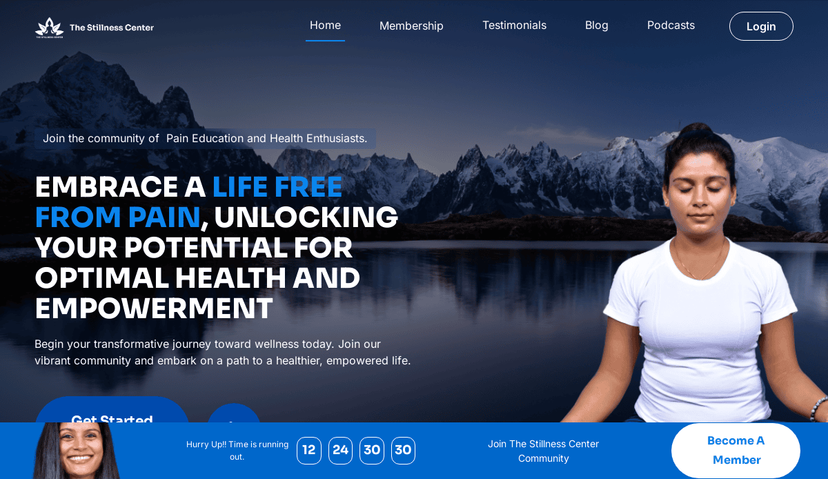 A woman sits in meditation with closed eyes, framed by snow-capped mountains and a tranquil lake. The wellness website promotes health, wellness, and membership at The Stillness Center, with clear navigation, sign-up buttons, and holistic web design.