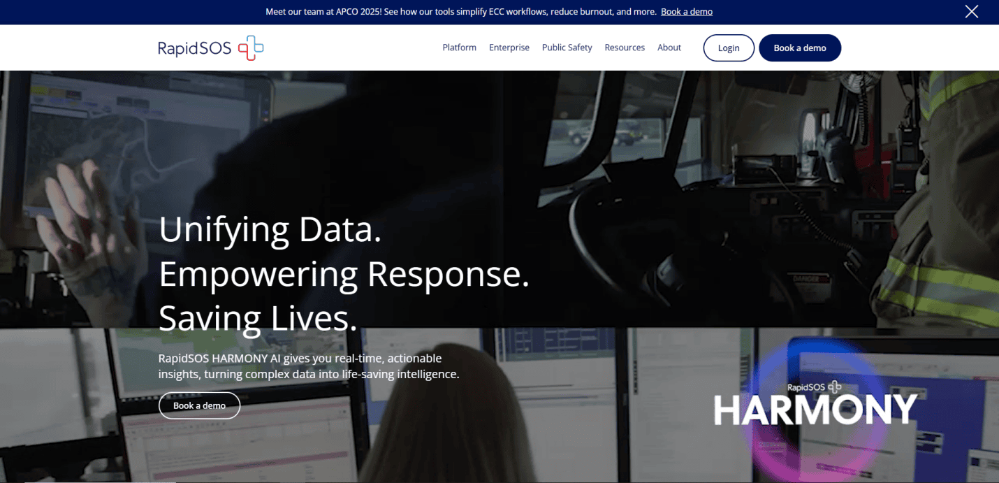 Screenshot of the RapidSOS website homepage featuring the text: Unifying Data. Empowering Response. Saving Lives. with images of emergency response operators at computer stations and the RapidSOS HARMONY logo.
