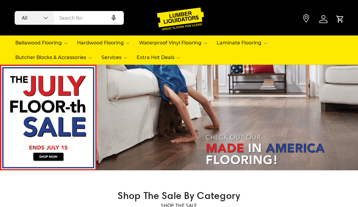 Screenshot of the Lumber Liquidators flooring website design homepage. A banner highlights the JULY FLOOR-th SALE ending July 15, and a child does a backbend on a wood floor. Navigation menus and a search bar are visible.