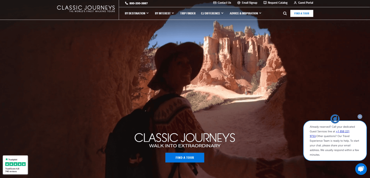 A person wearing a hat and backpack stands at the entrance of a red rock cave, looking out toward sunlit sandstone formations under a blue sky; text overlay highlights how our travel agency website design drives sales for Classic Journeys tours.