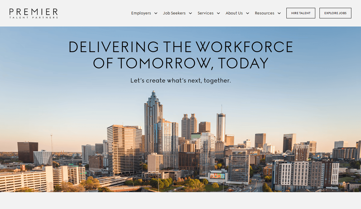 Skyline view of a modern city with tall buildings at sunset, featuring the Premier Talent Partners website header, navigation menu, and the slogan “Delivering the workforce of tomorrow, today.”.