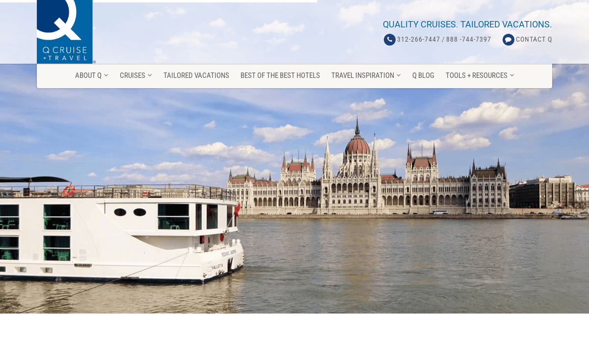 A white river cruise ship sails on a wide river with the Hungarian Parliament Building and a cloudy blue sky in the background.