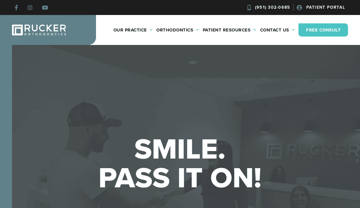 Screenshot of Rucker Orthodontics’ website homepage showing their logo, navigation menu, contact information, and the slogan “SMILE. PASS IT ON!” over an image of people in a dental office.