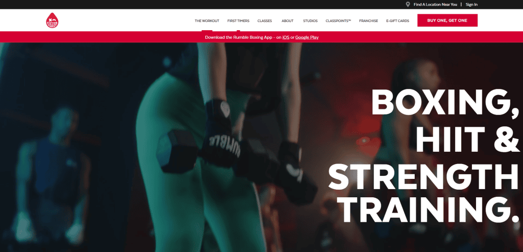 A person holding two dumbbells in a gym setting, with large bold text that reads “Boxing, HIIT & Strength Training” on the right side of the image.