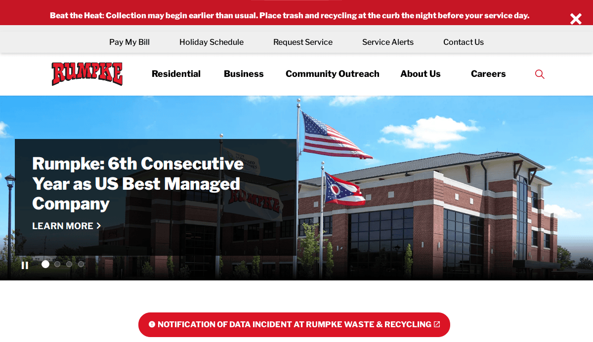A brick office building with U.S. and Ohio flags in front. The website header reads Rumpke: 6th Consecutive Year as US Best Managed Company. A red banner at the bottom announces a data incident at Rumpke Waste & Recycling.